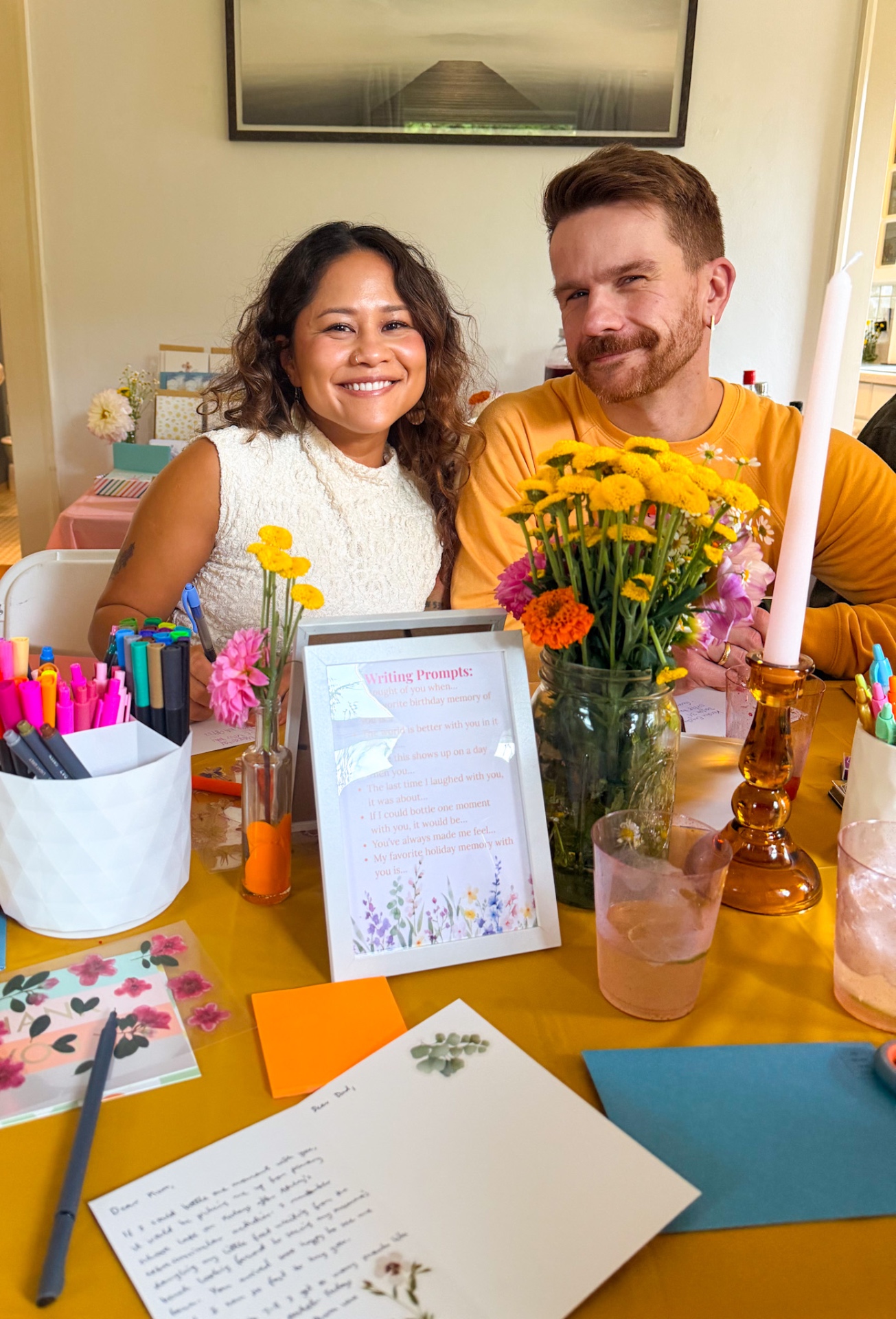 Two guests smiling at a Sip & Send Co. letter-writing party
